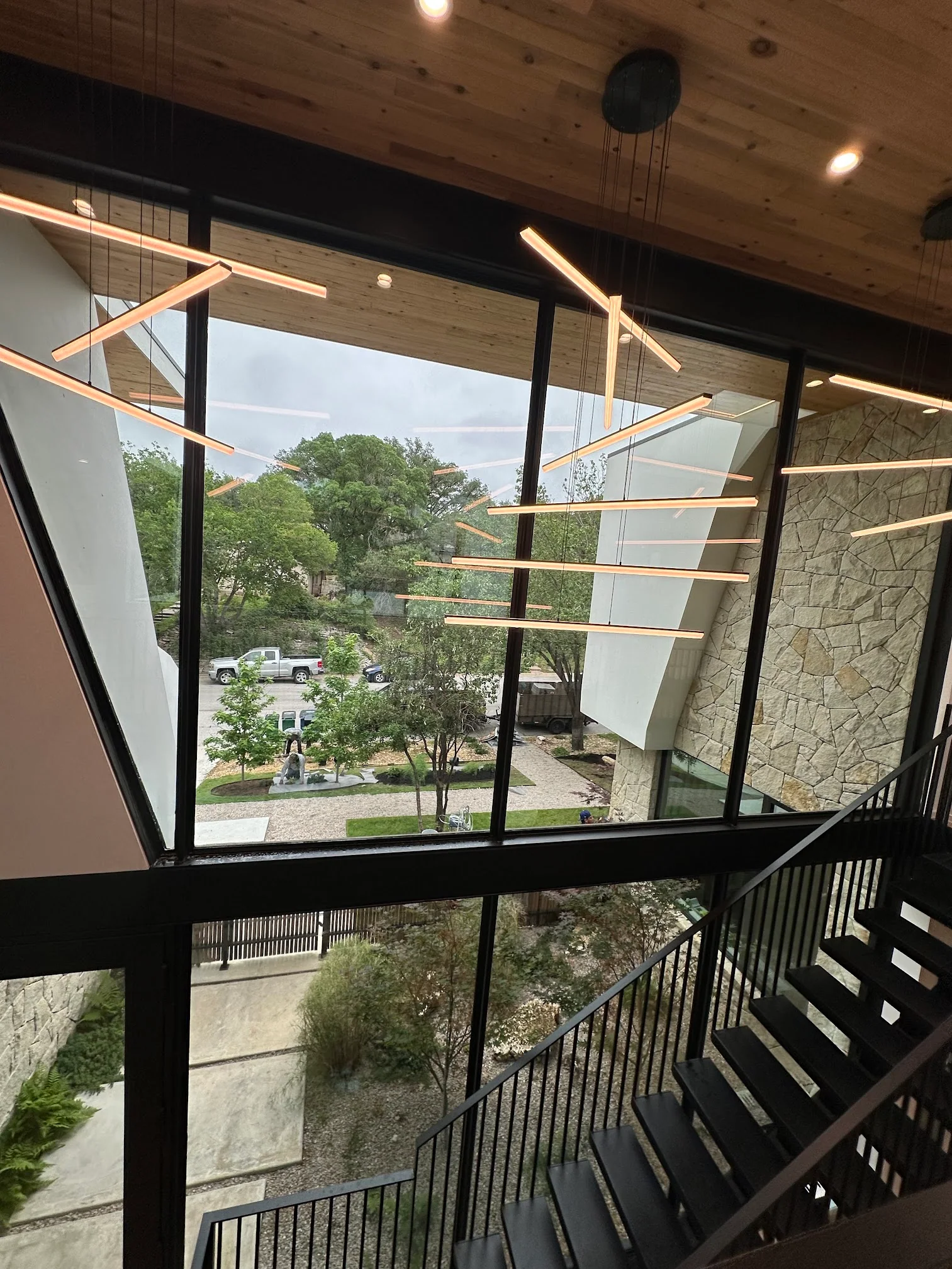 Large commercial stairwell windows with clean glass and architectural lighting